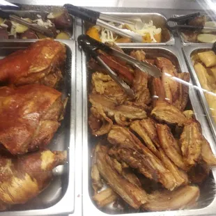 Pork, chicharon, and tamales.are among the hot bar offerings. Tables in market to eat at and relax.
