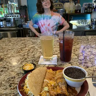 Pick two combination of the crispy beef taco and a beef enchilada with Spanish rice and Oaxacan Black Beans