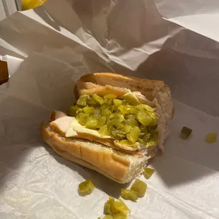 a hot dog with pickles