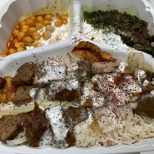 a variety of foods in a styrofoam container