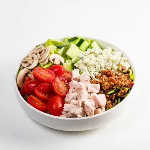 a white bowl of salad