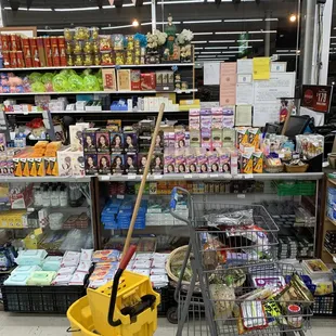 a shopping cart with a broom