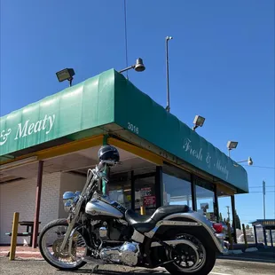 a motorcycle parked in front of a restaurant