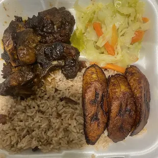 Cabbage, oxtail, plantains, rice and beans