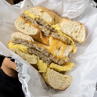 Breakfast bagel w egg, sausage and cheese on an onion bagel. Yum!!