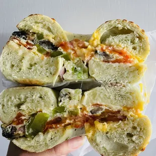 Cross-section of Veggie Omelet on a spinach parmesan bagel--my fave!
