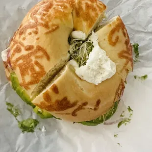 Heavenly Veggie (cream cheese, tomato, red onions, avocado, sprouts) on an Asiago bagel