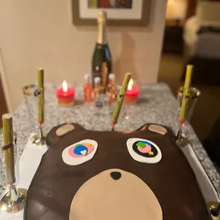 a chocolate cake with a bear face on it