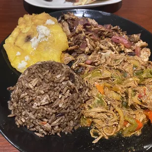 Cuban combo with green Fried plantains tostones and arroz moro