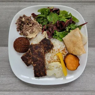 a plate of food on a wooden table