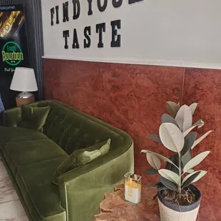 a living room with a green couch