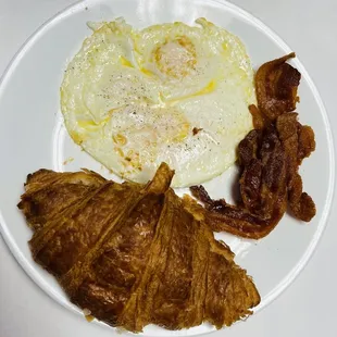 Breakfast plate  3 eggs     3 slices bacon    1 croissant