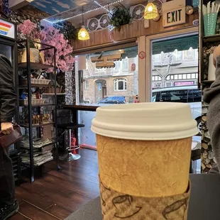 a man standing in a coffee shop