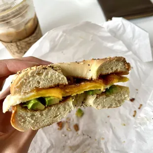 Egg cheese bacon avocado breakfast sandwich on a bagel