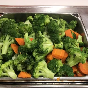 Steamed broccoli and carrots. Eat your veggies at fresh choice cafe. All vegetables are hand picked from farmers market