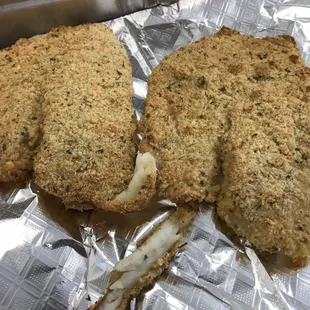 Parmesan crusted fresh water tilapia. 31 grams of protein served over steamed rice and a side salad or 2 sides and drink. We are on UBEREATS