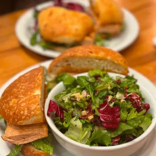 a bowl of salad and a sandwich