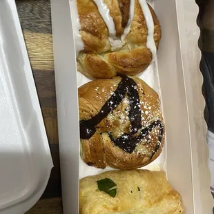 Top-bottom: blueberry cream cheese filled croissant, chocolate and cream cheese filled croissant, spinach feta