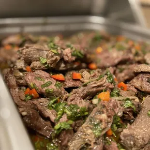 beef and vegetables in a pan