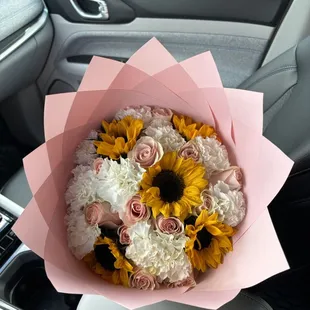 Freestyle pink bouquet. Sunflowers, carnations, and blush roses