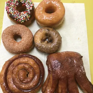 a variety of doughnuts on a tray