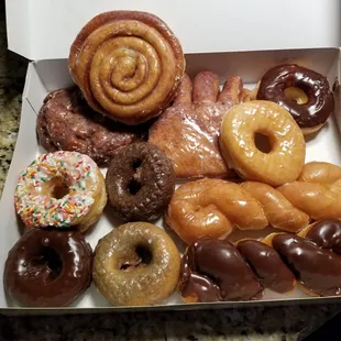 Apple fritter, bear claw, cinnamon roll, glaze twist, chocolate twist, cake donuts, sprinkles and all.