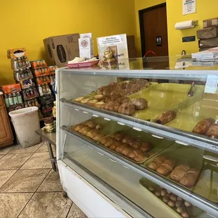 a display case with a variety of donuts