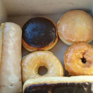 Maple raised, cream-filled, blueberry-filled, glazed, cake donut with orange frosting, chocolate raised. These donuts are so good.