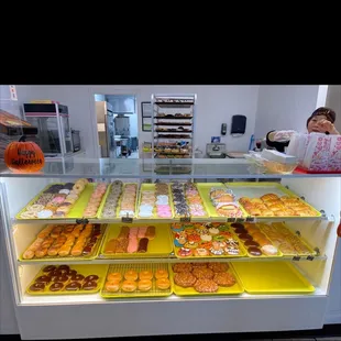 a display case filled with various types of donuts