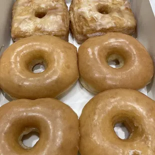 six glazed donuts in a box