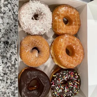 a variety of donuts in a box