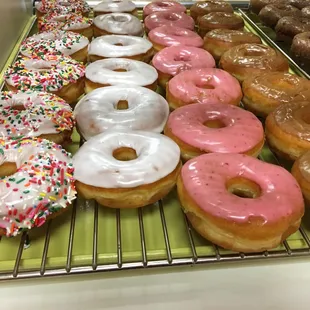 Strawberry, white and maple donuts
