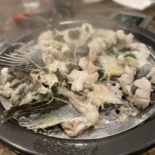 a plate of fish being cooked