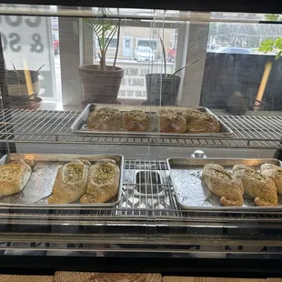 breads and pastries in a display case