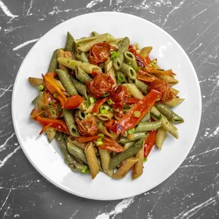 a plate of green beans and tomatoes