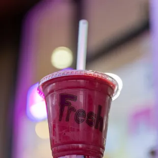 a red cup with a straw