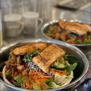 two bowls of salad with tofu