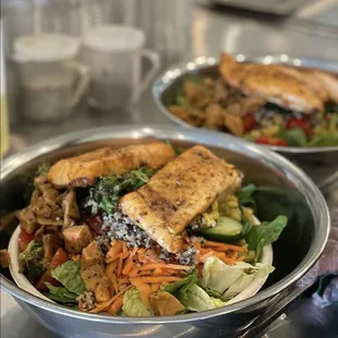 two bowls of salad with tofu