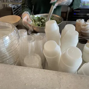 The lady mixing my salad.