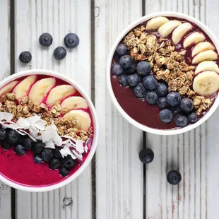 two bowls of fruit and yogurt