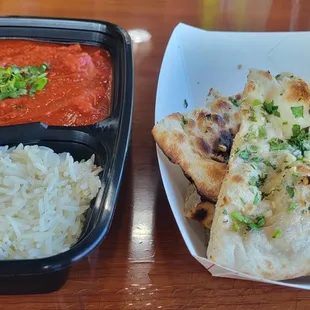 Spicy Chicken Vindaloo with nan bread and rice.