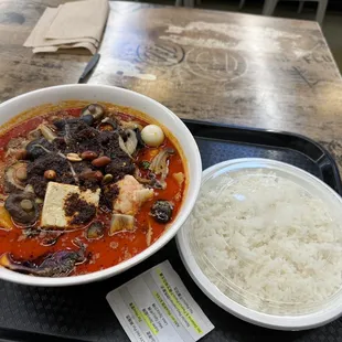 a bowl of soup and a bowl of rice