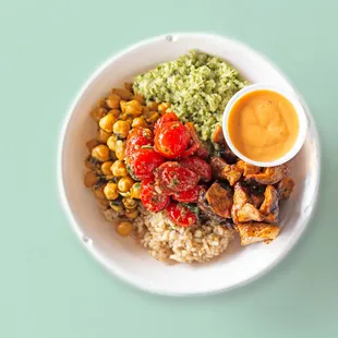 a bowl of food with rice and vegetables