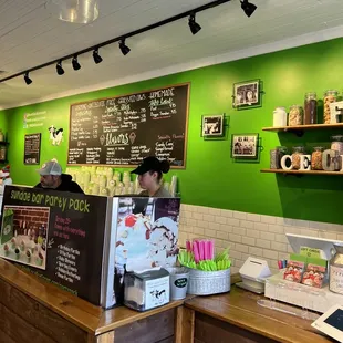 a man and a woman behind the counter