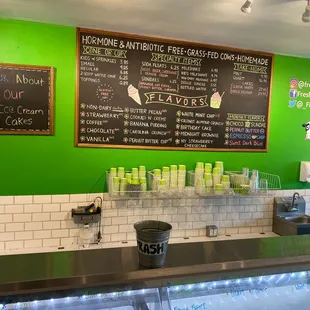 a green wall and menu