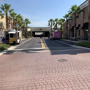 Two food vendors parked on a side street-- unofficially joining the once monthly market