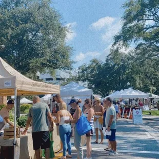 a crowd of people shopping