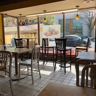 empty tables and chairs in a restaurant