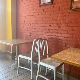 a table and two chairs in a restaurant