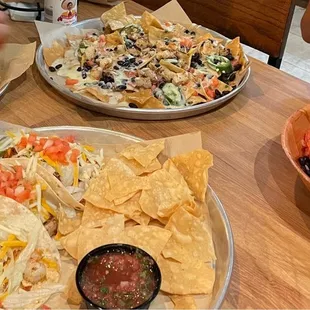 Shrimp nachos, shrimp tacos, blackened salmon bowl